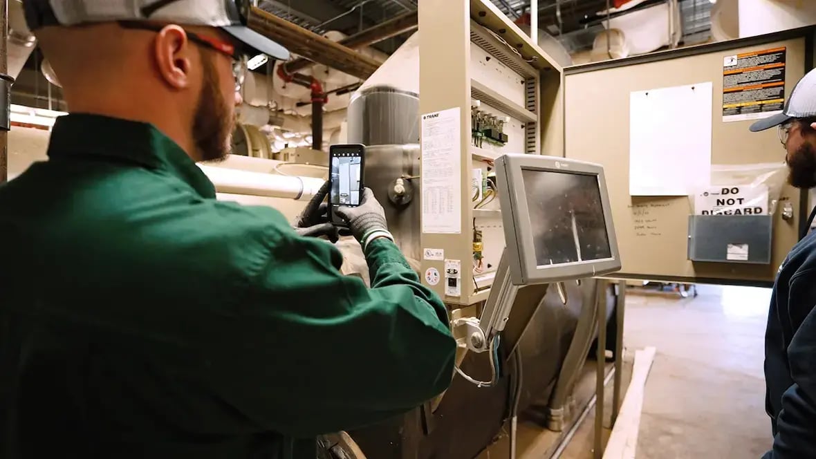 technician taking a photo in a factory